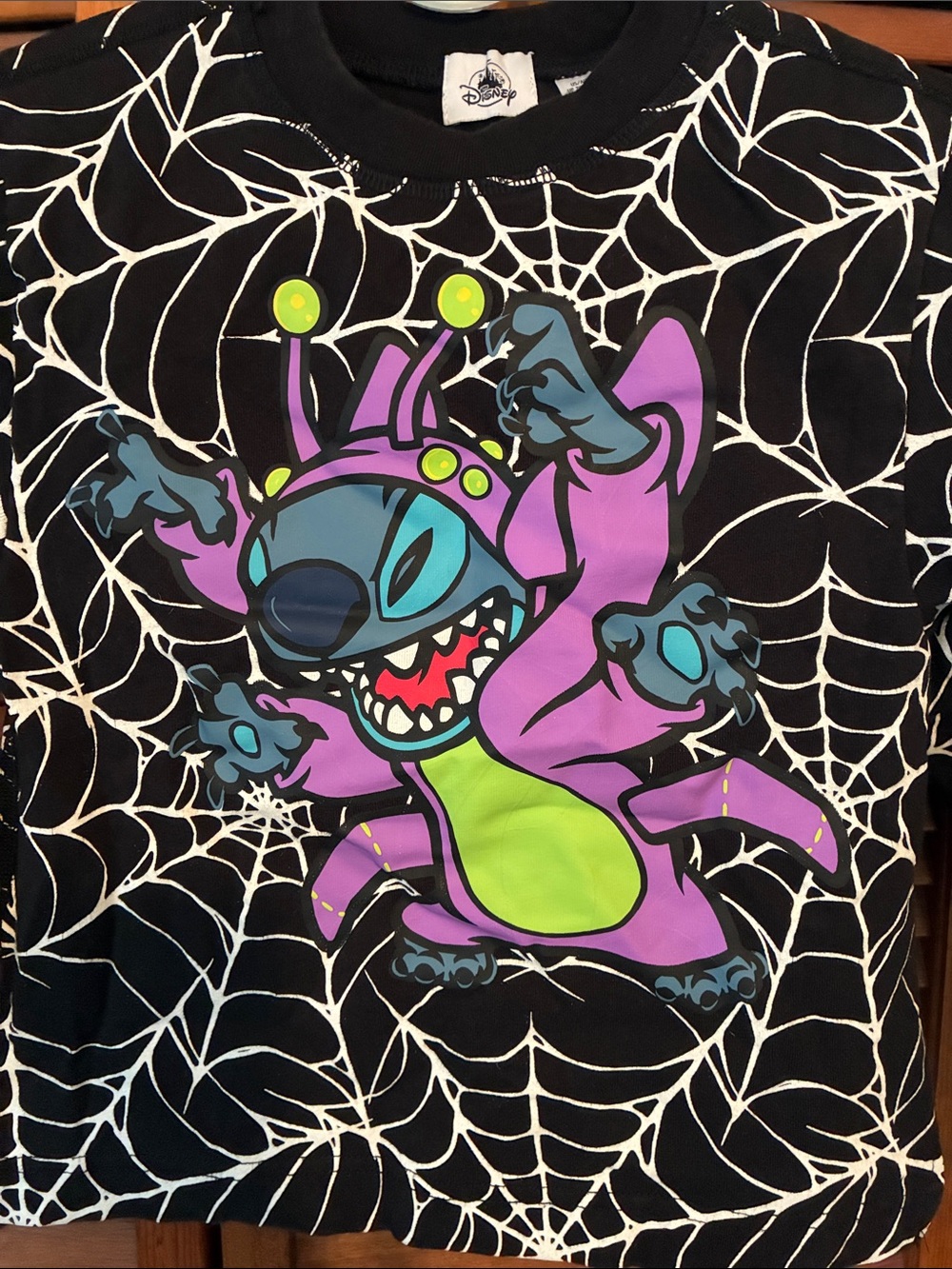 Disney Black long sleeved top with Purple Stitch Alien and Neon Green Accent